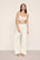 Model is wearing Pointelle Sweater Bralette  in  Ivory