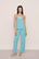Model is wearing Frida TENCEL™ Modal Cami & Pant PJ Set  in Blue Lagoon/Ivory