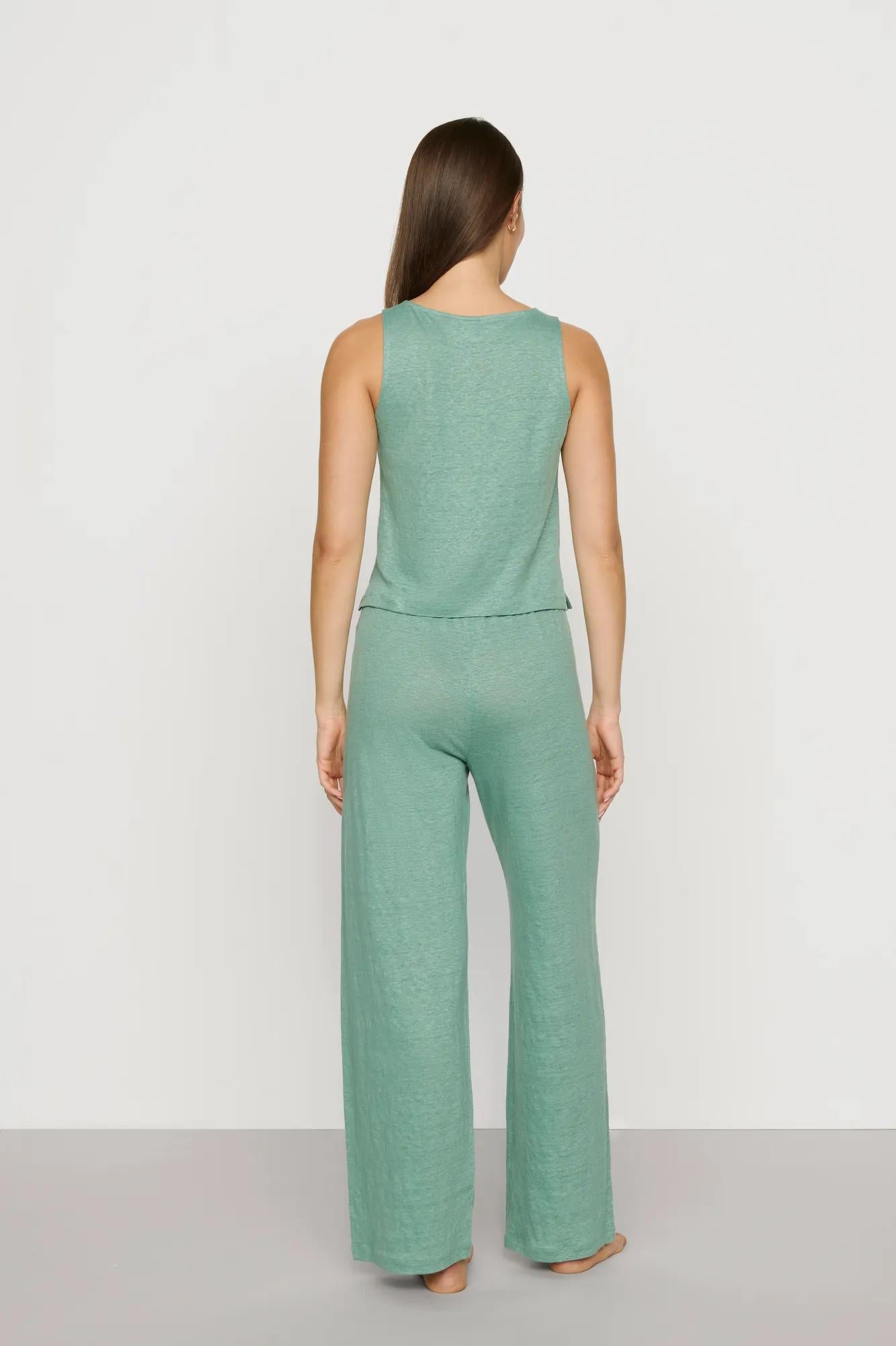 Model is wearing Organic Linen Knit Boat Neck Crop Tank in Seagrass