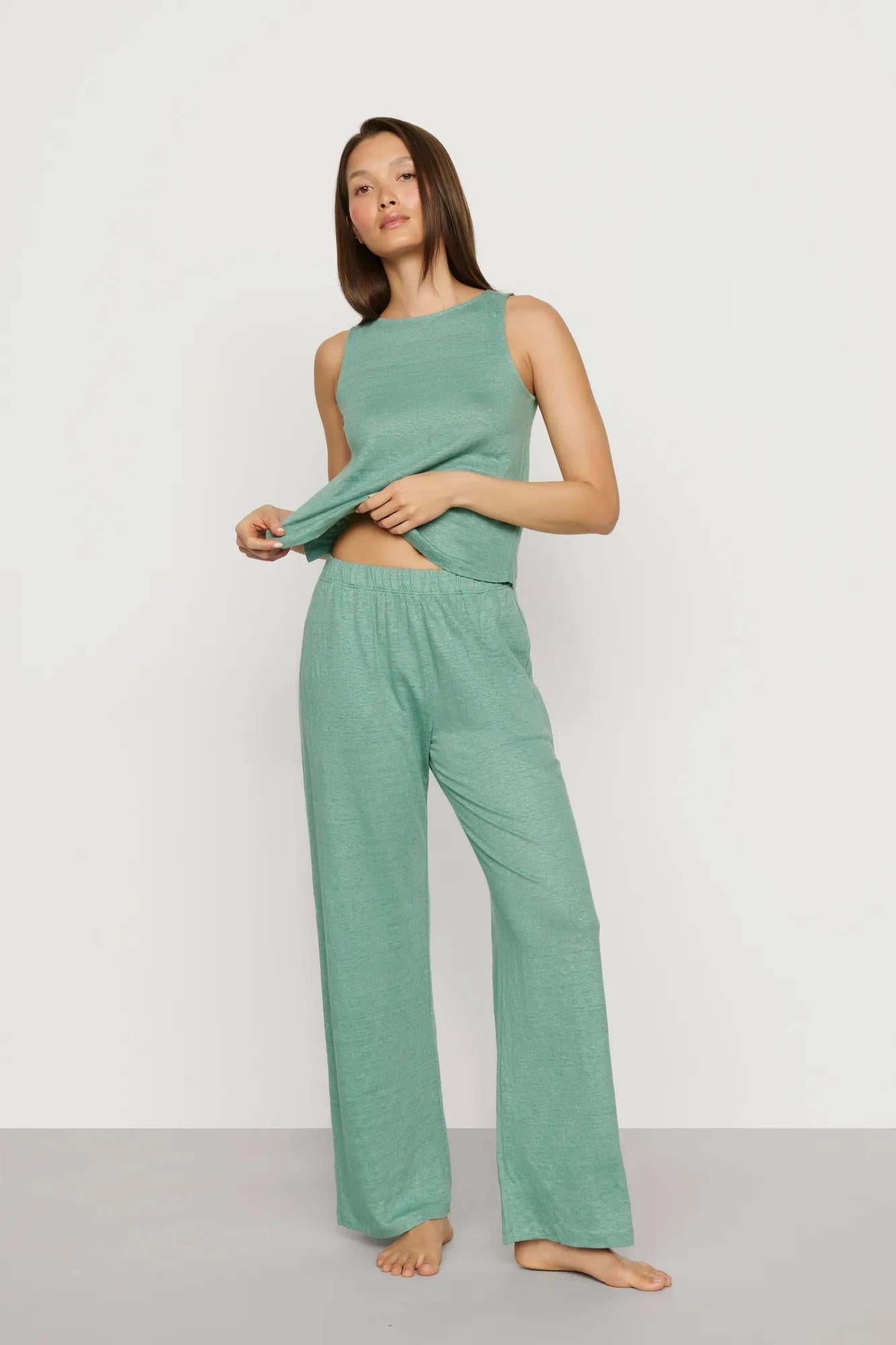 Model is wearing Organic Linen Knit Boat Neck Crop Tank in Seagrass