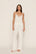 Model is wearing Kari Cami & Pant PJ Set in Ivory