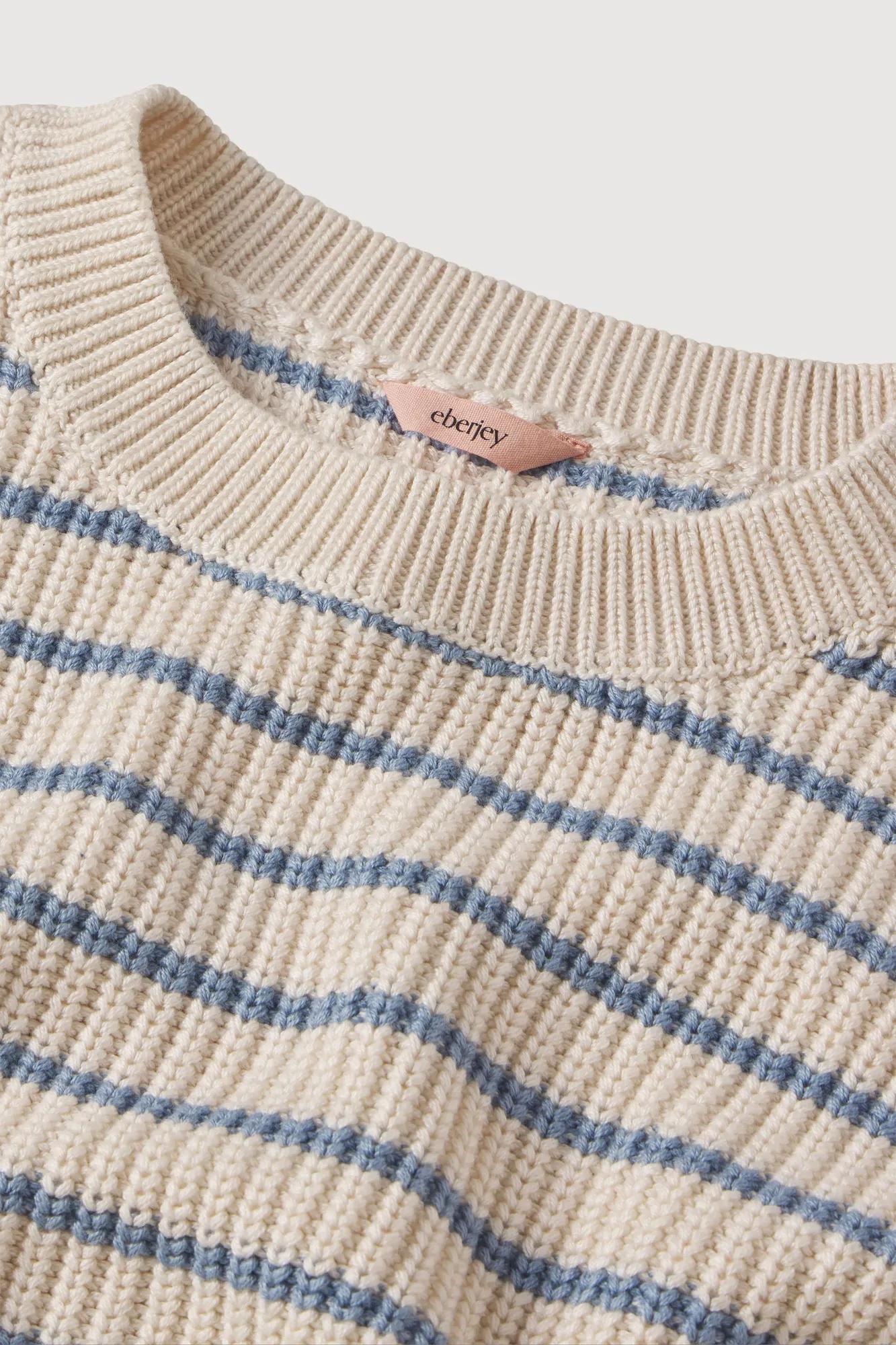 Model is wearing Coastal Cotton Sweaters Crew Neck Pullover in Stripe Almond Heather/Faded De