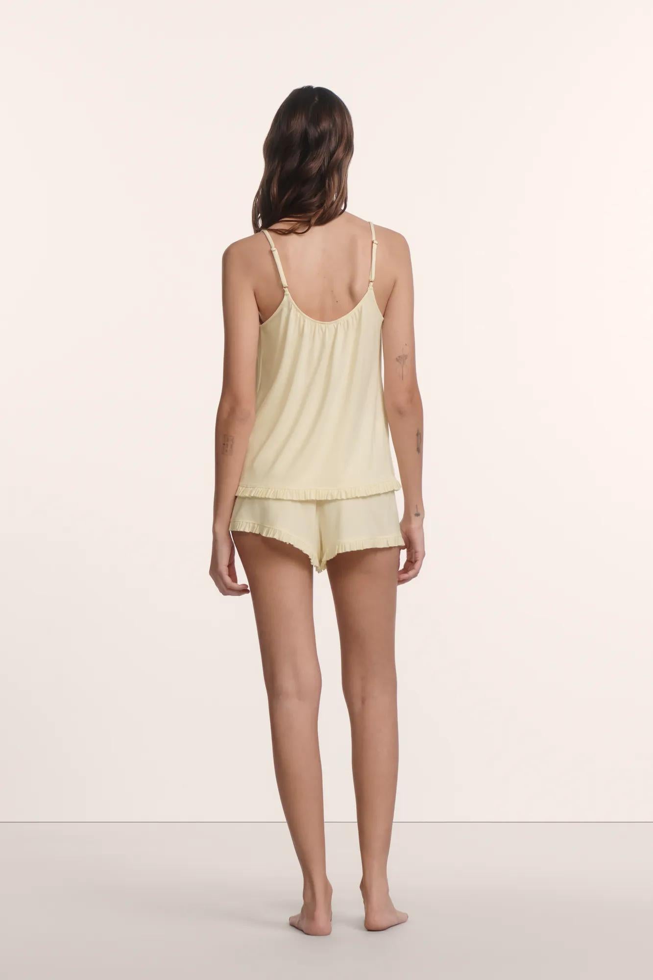 Model is wearing Gisele TENCEL™ Modal Ruffle Cami & Shortie Short Set in Buttercream