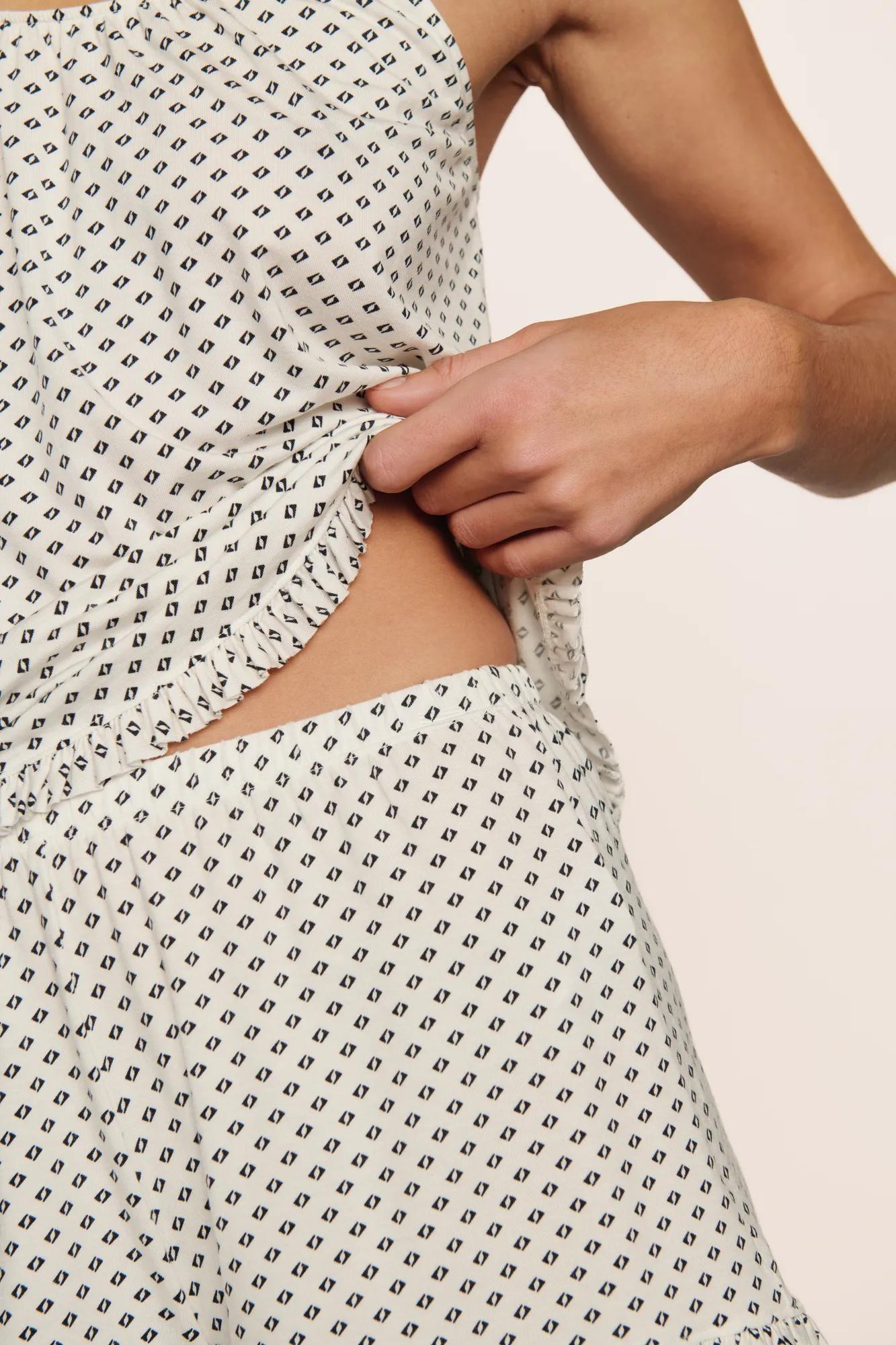 Model is wearing Gisele TENCEL™ Printed Modal Ruffle Cami & Shortie Short Set in Tide Dot Ivory