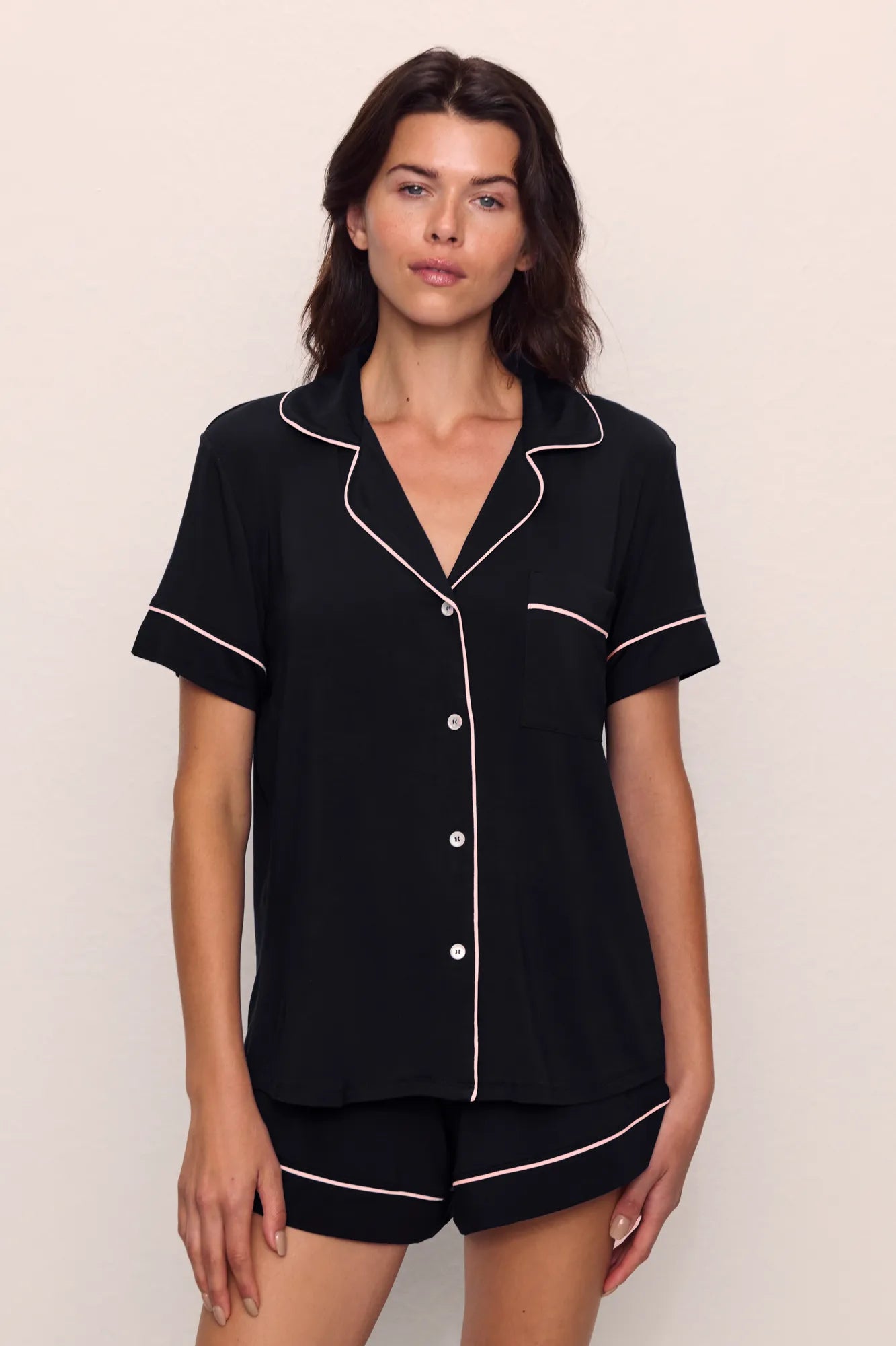 Model is wearing Gisele TENCEL™ Modal Relaxed Short PJ Set in Black/Sorbet Pink