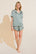 Model wears Inez Washable Silk Printed Short PJ Set in Tropical Tile Agave/Agave.
