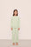 Model is wearing Kid's French Terry Sweatshirt and Jogger Set in  Matcha
