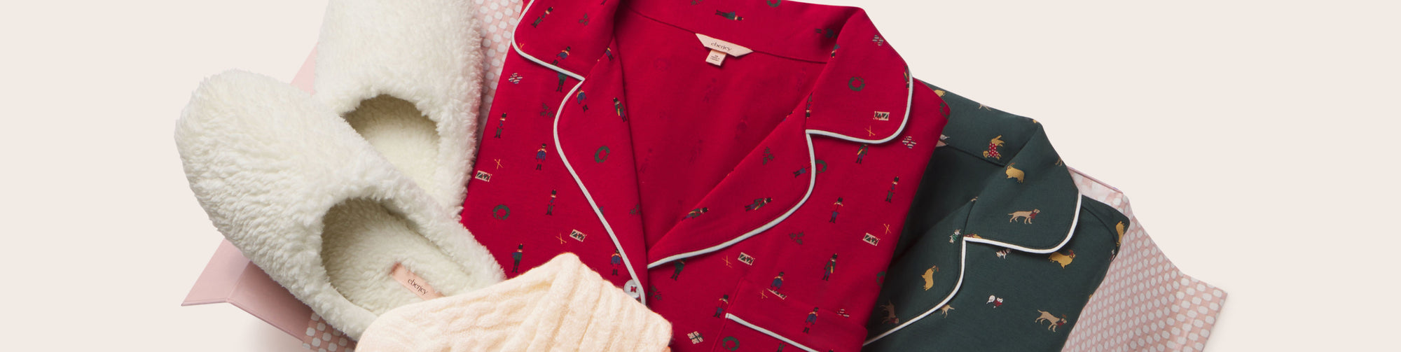 Image of gift box with Sherpa Slippers and Holiday PJs in Holiday Dog Pine and Nutcracker Holly Red Print