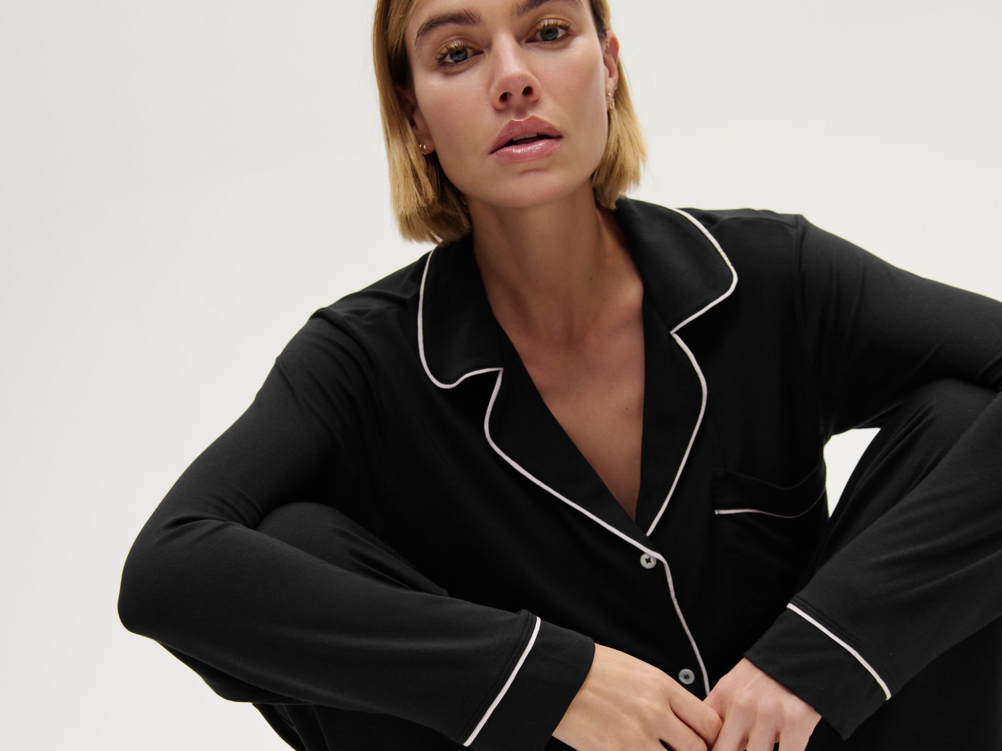 Model wearing Gisele TENCEL Modal Long PJ Set in Black/Sorbet Pink