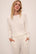 Model wears Cozy Time Crew Neck Pullover in Ivory.