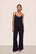 Model is wearing Gisele TENCEL™ Modal Cami & Pant PJ Set in Black