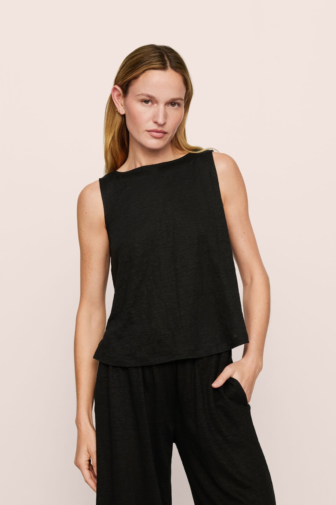 Model is wearing Organic Linen Knit Boat Neck Crop Tank in Black