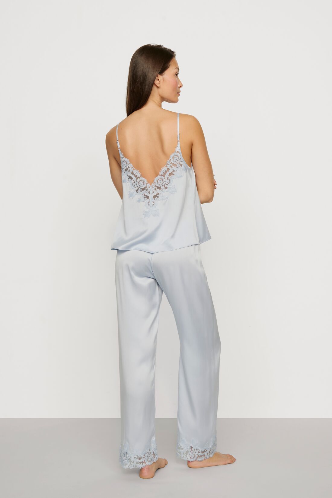 Model is wearing Washable Silk with Lace Embroidery Cami & Pant PJ Set in Powder Blue
