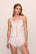Model is wearing Mariana Romper in White