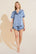 Model wears Inez Washable Silk Short PJ Set in Wedgewood Blue/Navy.