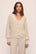 Model is wearing Fine Gauge Sweater Cardigan in Almond Heather