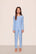 Model is wearing Kids Printed TENCEL™ Modal Unisex Long PJ Set in Nordic Stripe Vista Blue/White