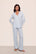 Model is wearing Gisele TENCEL™ Modal Long PJ Set in Ice Blue/Ivory