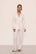 Model wears Gisele TENCEL™ Modal Long PJ Set in Pure Ivory/Navy