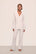 Model is wearing Gisele TENCEL™ Modal Long PJ Set in White/Ice Blue