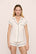 Model is wearing Gisele TENCEL™ Modal Shortie Short PJ Set in Pure Ivory/Navy