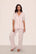 Model is wearing Gisele TENCEL™ Modal Short Sleeve & Pant PJ Set in Sorbet Pink/Black