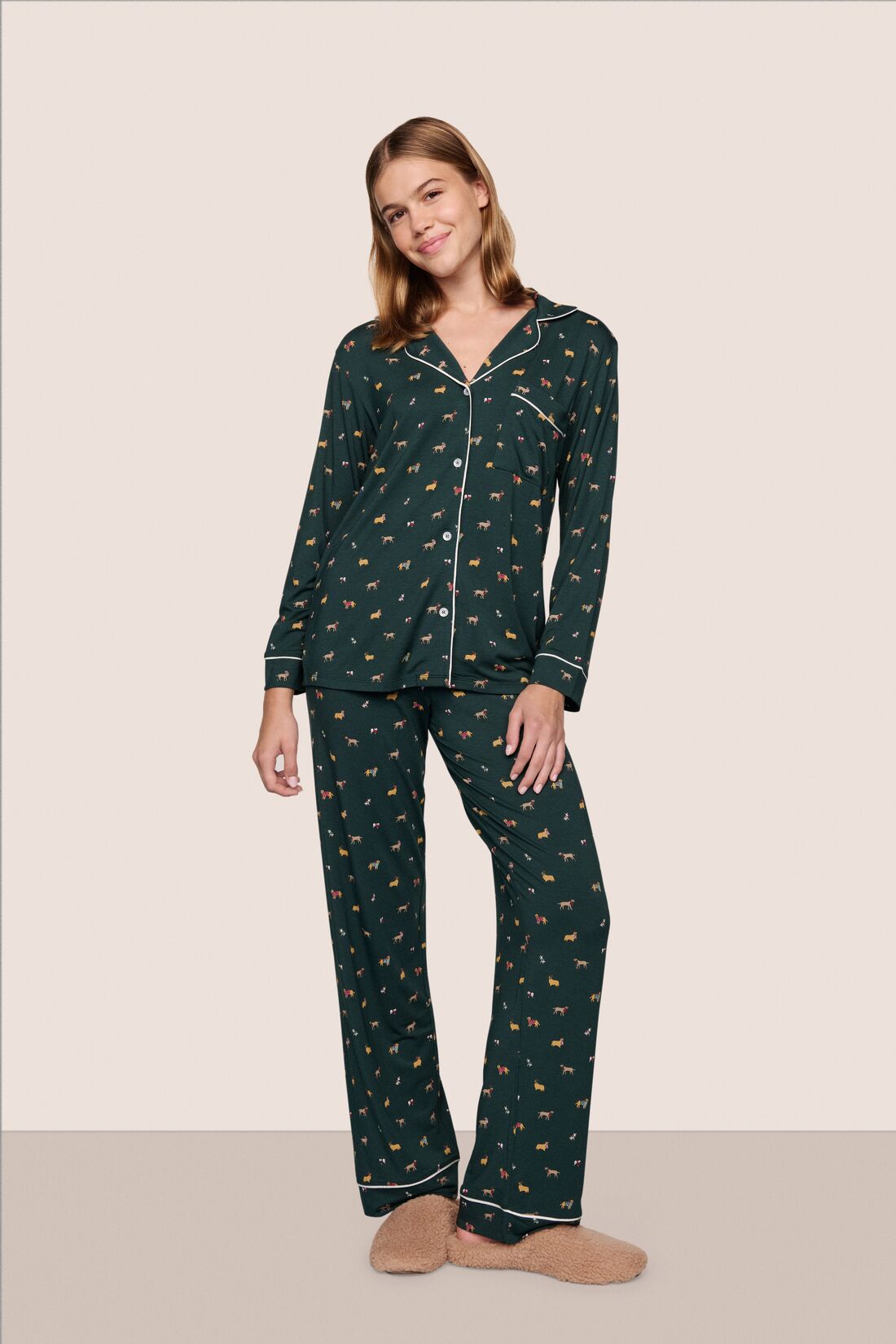 Model is wearing Gisele Printed TENCEL™ Modal Long PJ Set  in Holiday Dogs Pine/Ivory