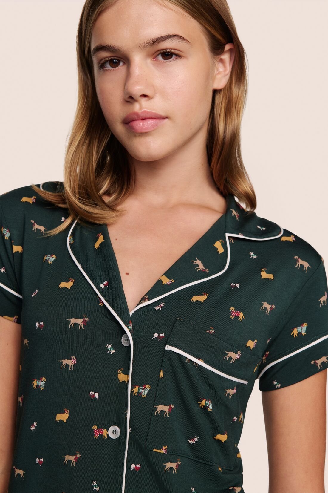 Model is wearing Gisele Printed TENCEL™ Modal Shortie Short PJ Set in Holiday Dog Pine/Ivory