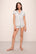 Model wears Gisele Printed TENCEL™ Modal Shortie Short PJ Set in Petite Batik Ivory/Denim Blue.