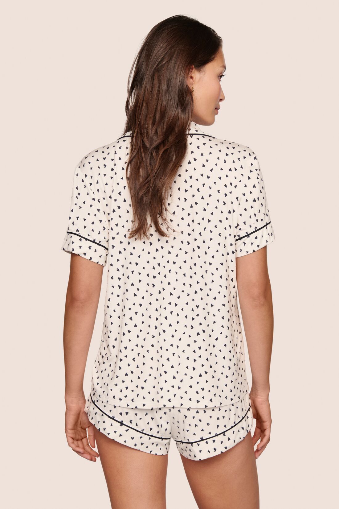 Model is wearing Gisele Printed TENCEL™ Modal Relaxed Short PJ Set  in Heart To Heart Black/Blk