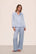 Model is wearing Inez Washable Silk Long PJ Set in Powder Blue/Champagne