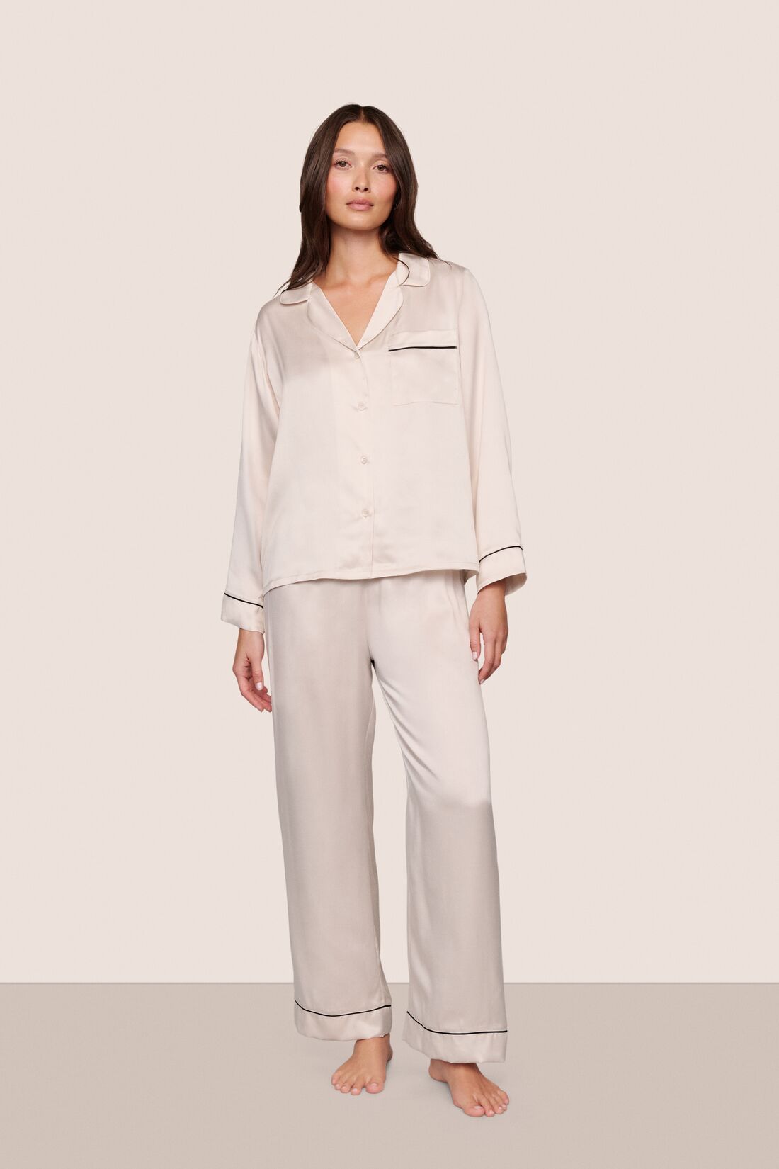 Model wearing Inez Washable Silk Long PJ Set in Heart to Silver Pink/Black
