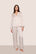 Model wearing Inez Washable Silk Long PJ Set in Heart to Silver Pink/Black