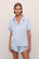 Model is wearing Inez Washable Silk Short PJ Set in Powder Blue/Champagne