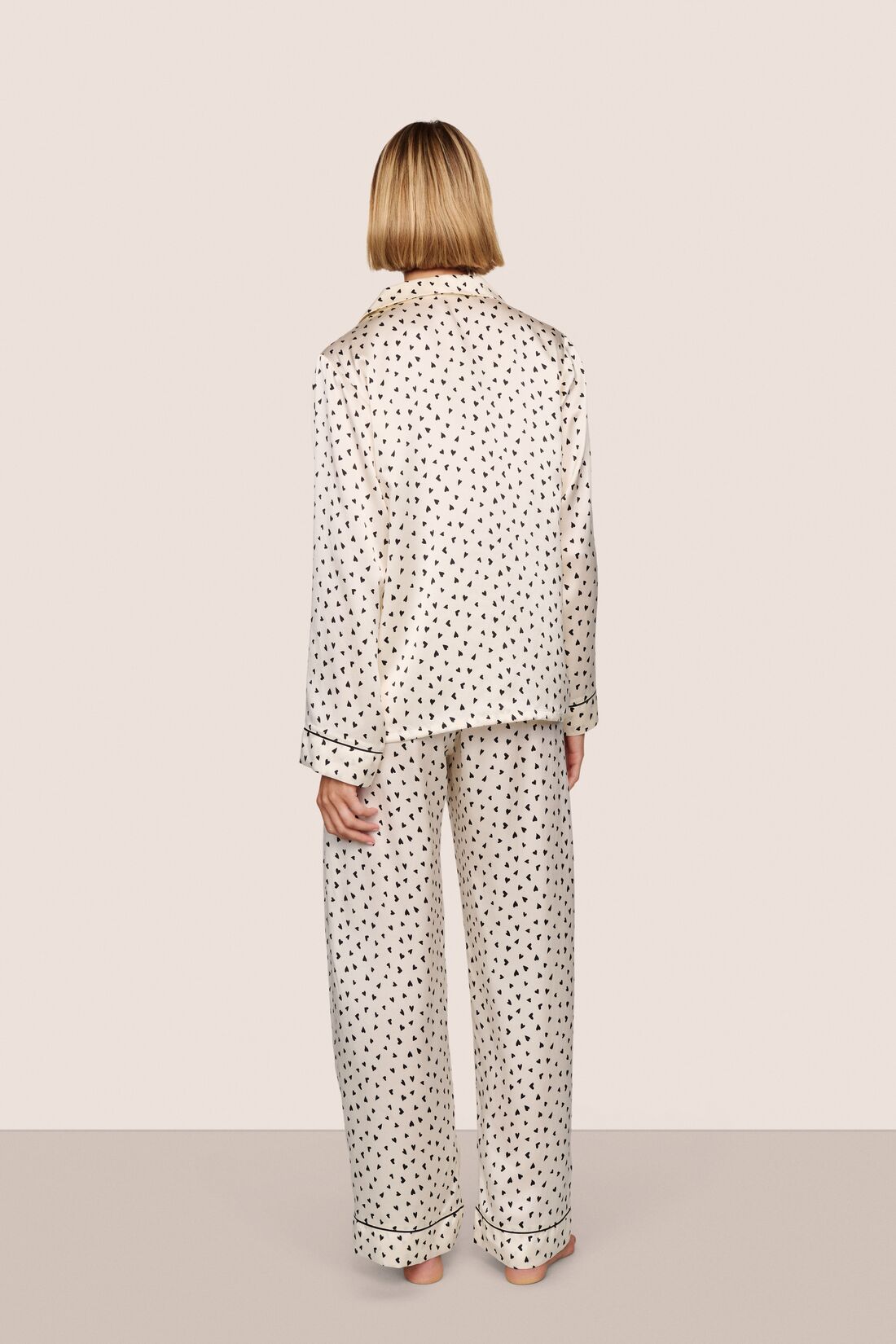 Model wearing Inez Washable Silk Printed Long PJ Set in Heart to Heart Black/Black