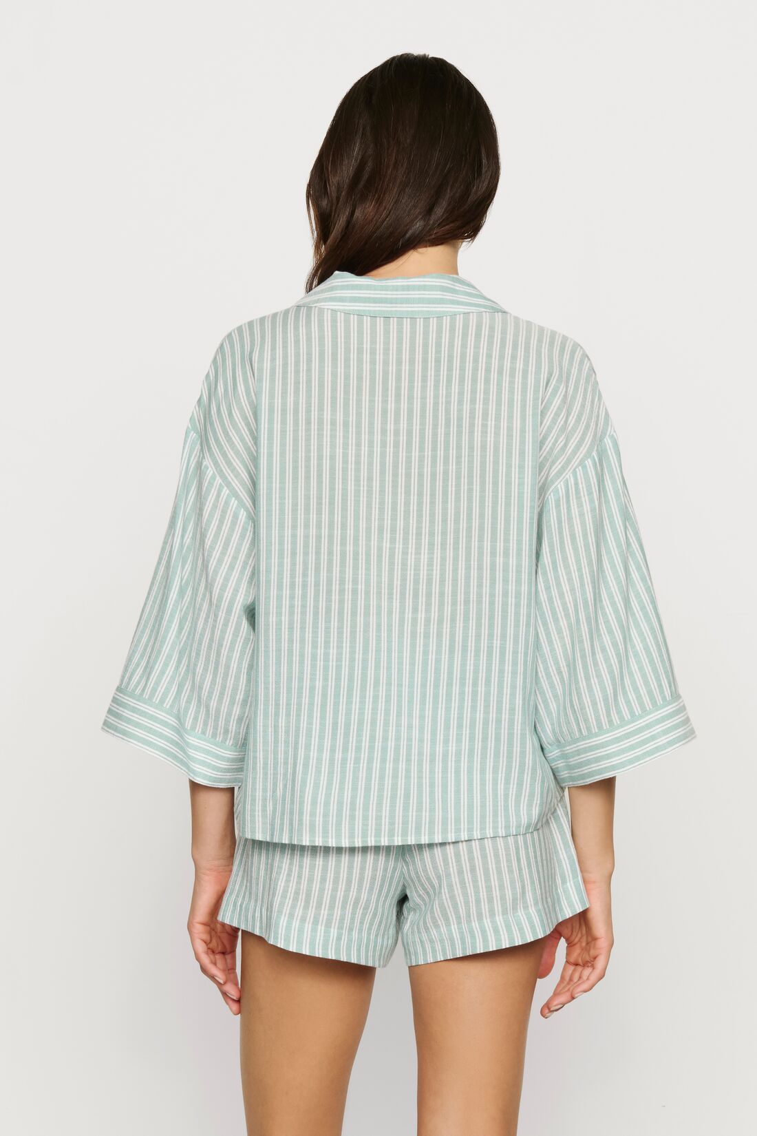 Model is wearing Nautico Relaxed Short PJ Set in Regatta Stripe Seagrass/White
