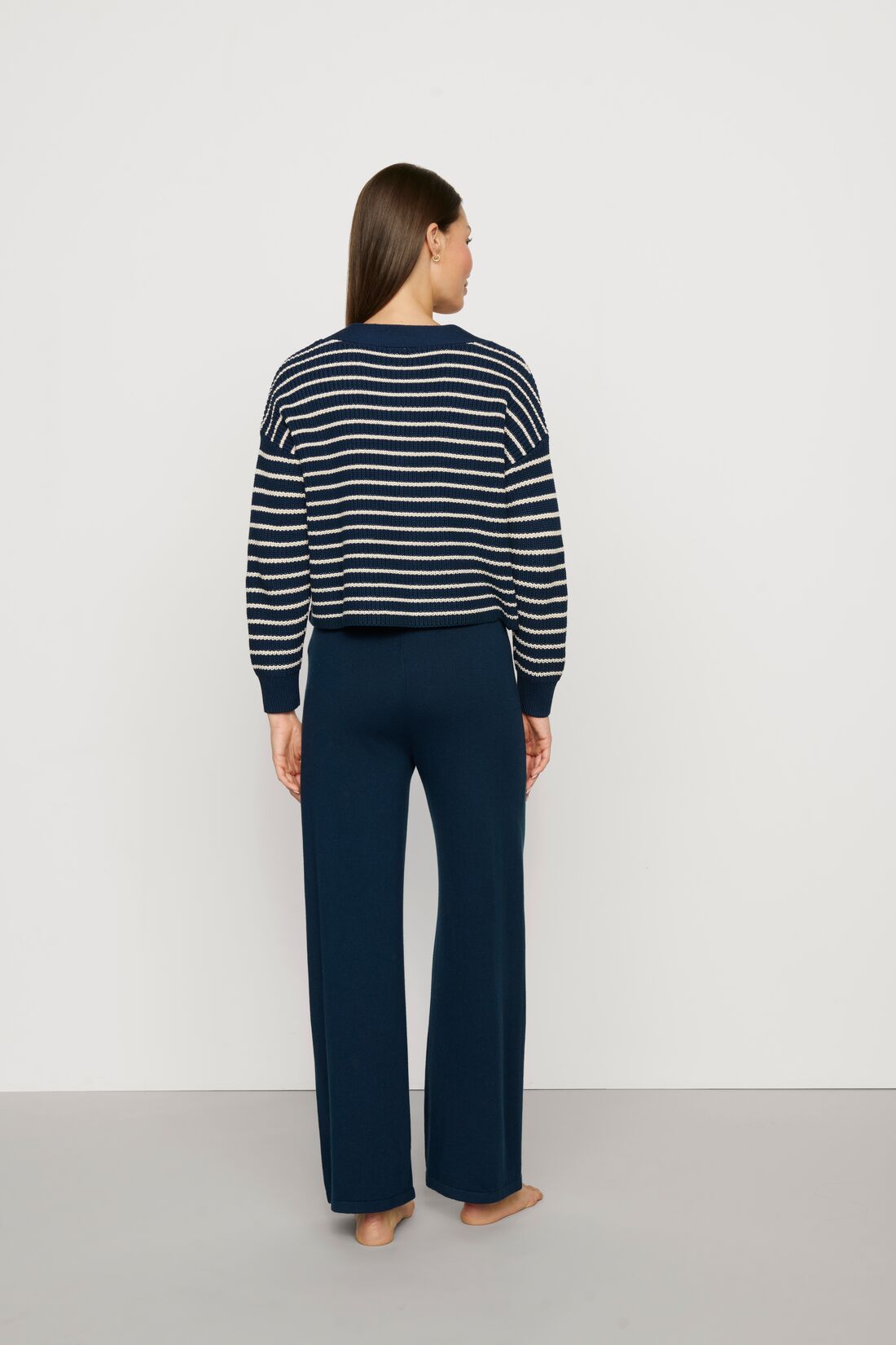 Model is wearing Fine Gauge Sweater Pant in Navy