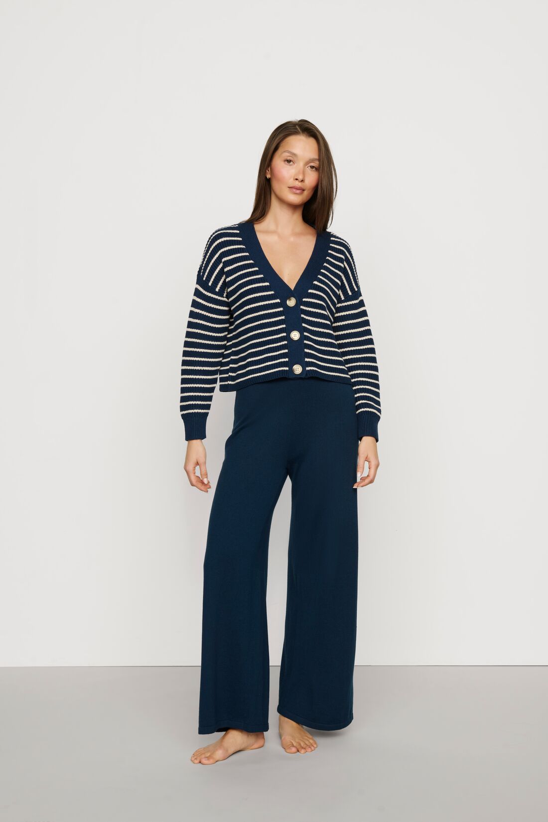 Model is wearing Fine Gauge Sweater Pant in Navy