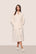 Model is wearing Renew plush Robe in Ivory