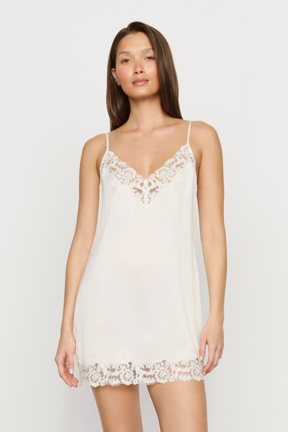 Model is wearing Washable Silk with Lace Embroidery Short Slip in Ivory