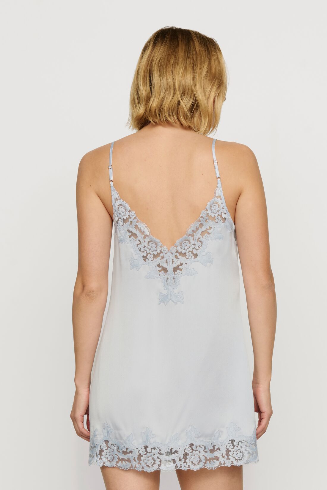 Model is wearing Washable Silk with Lace Embroidery Short Slip in Powder Blue