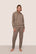 Model is wearing Recycled Boucle Hoodie in Deep Taupe