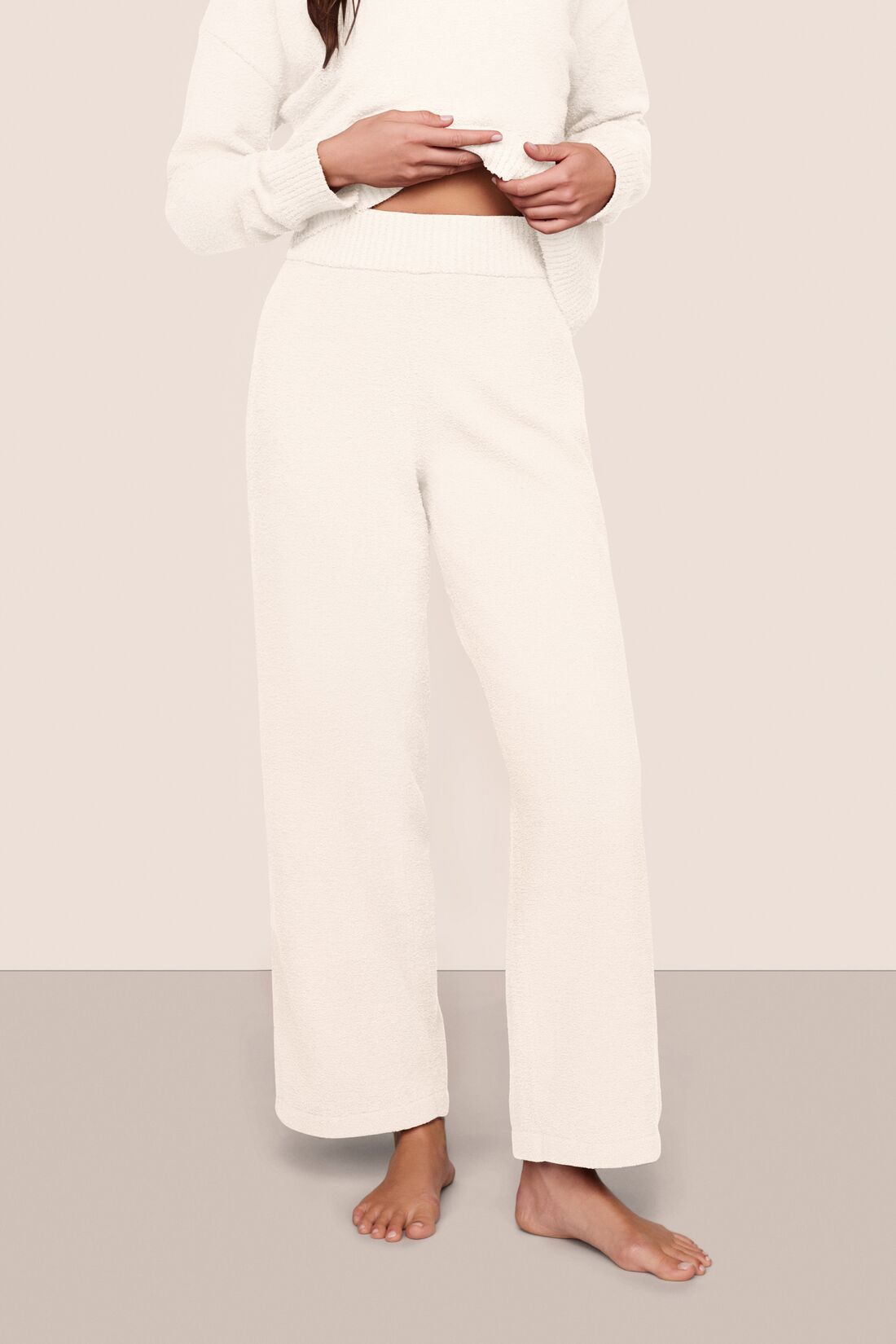 Model wearing recycled boucle pant in ivory