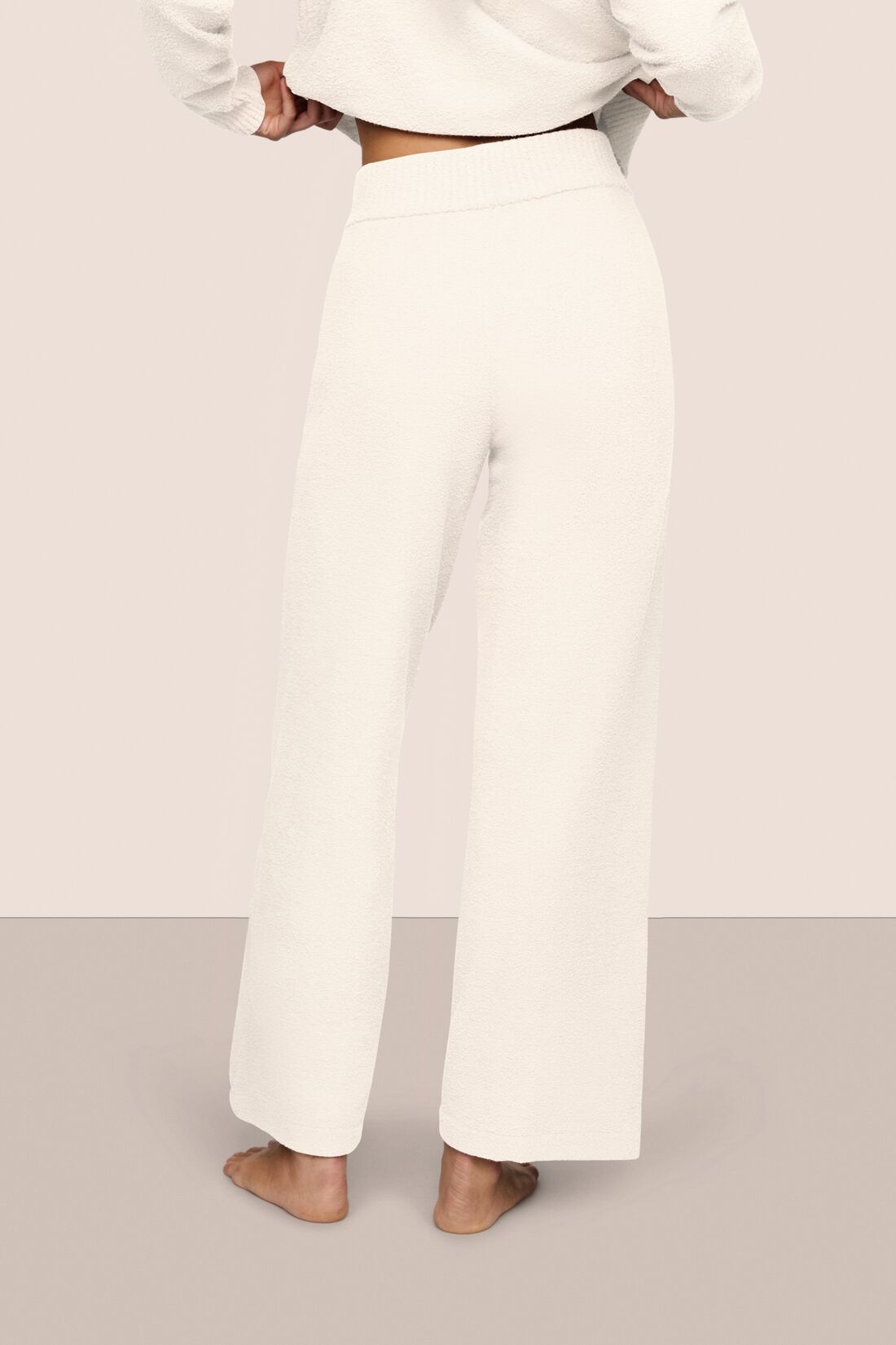 Model wearing recycled boucle pant in ivory