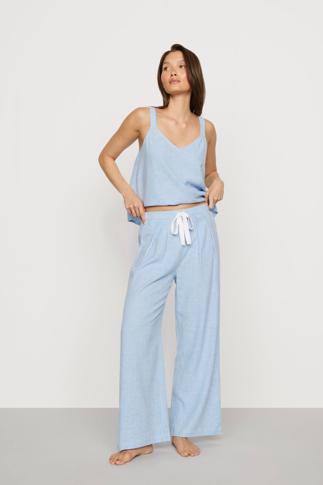 Model is wearing Linen Blend Relaxed Pant in Gingham White/Summer Blue