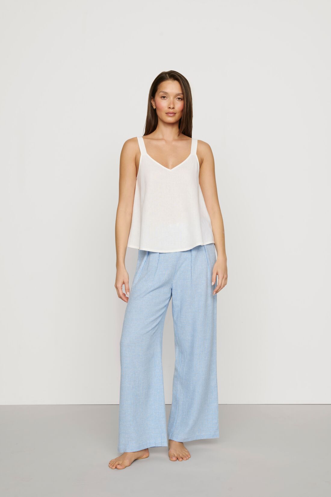 Model is wearing Linen Blend Relaxed Pant in Gingham White/Summer Blue