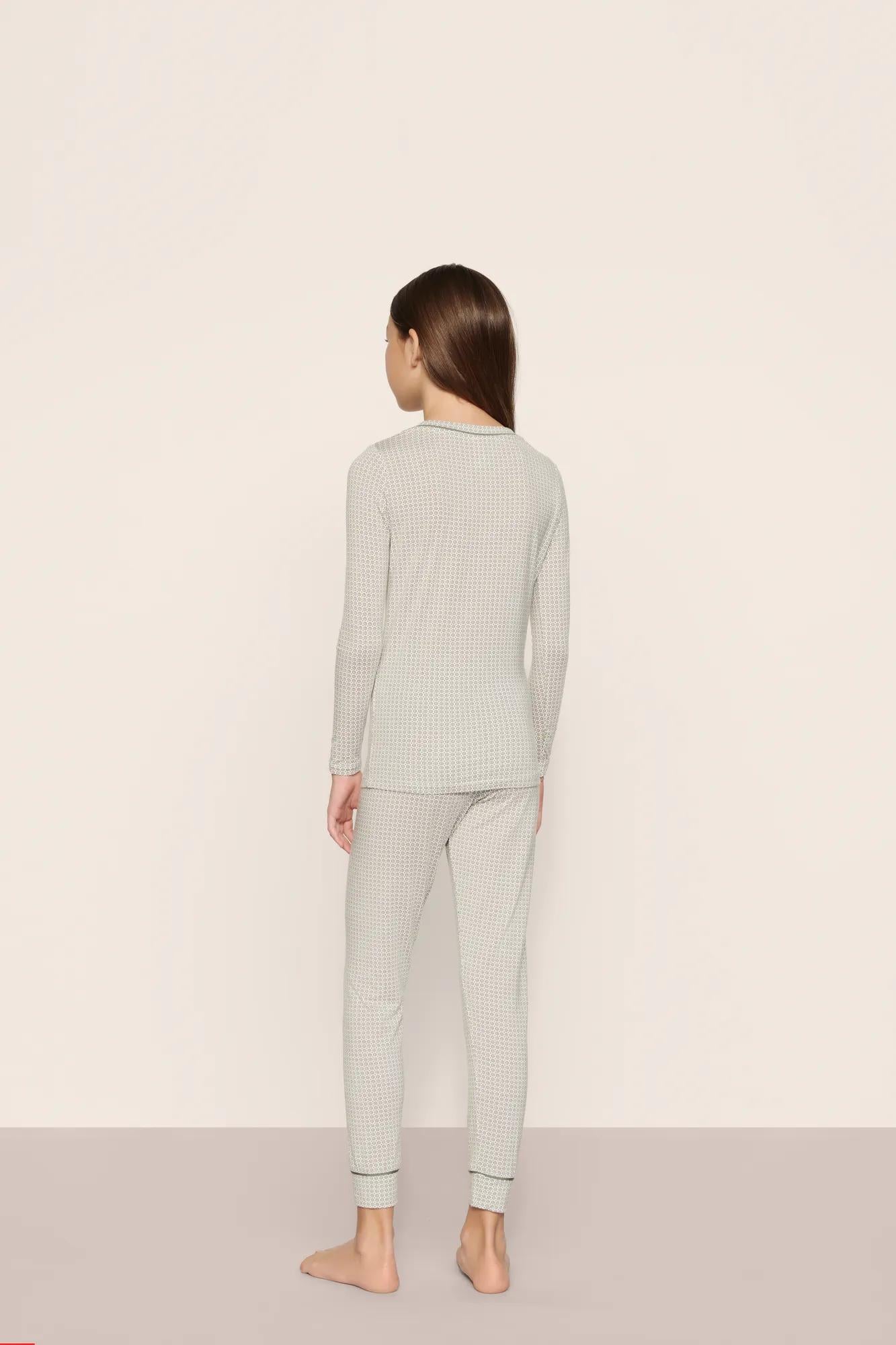 Model is wearing Kids Printed TENCEL™ Modal Unisex Long PJ Set  in  Geo Mod Desert Sage/Desert Sag