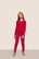 Model is wearing Kids Printed TENCEL™ Modal Unisex Long PJ Set  in Nutcracker Holly Red/Ivory