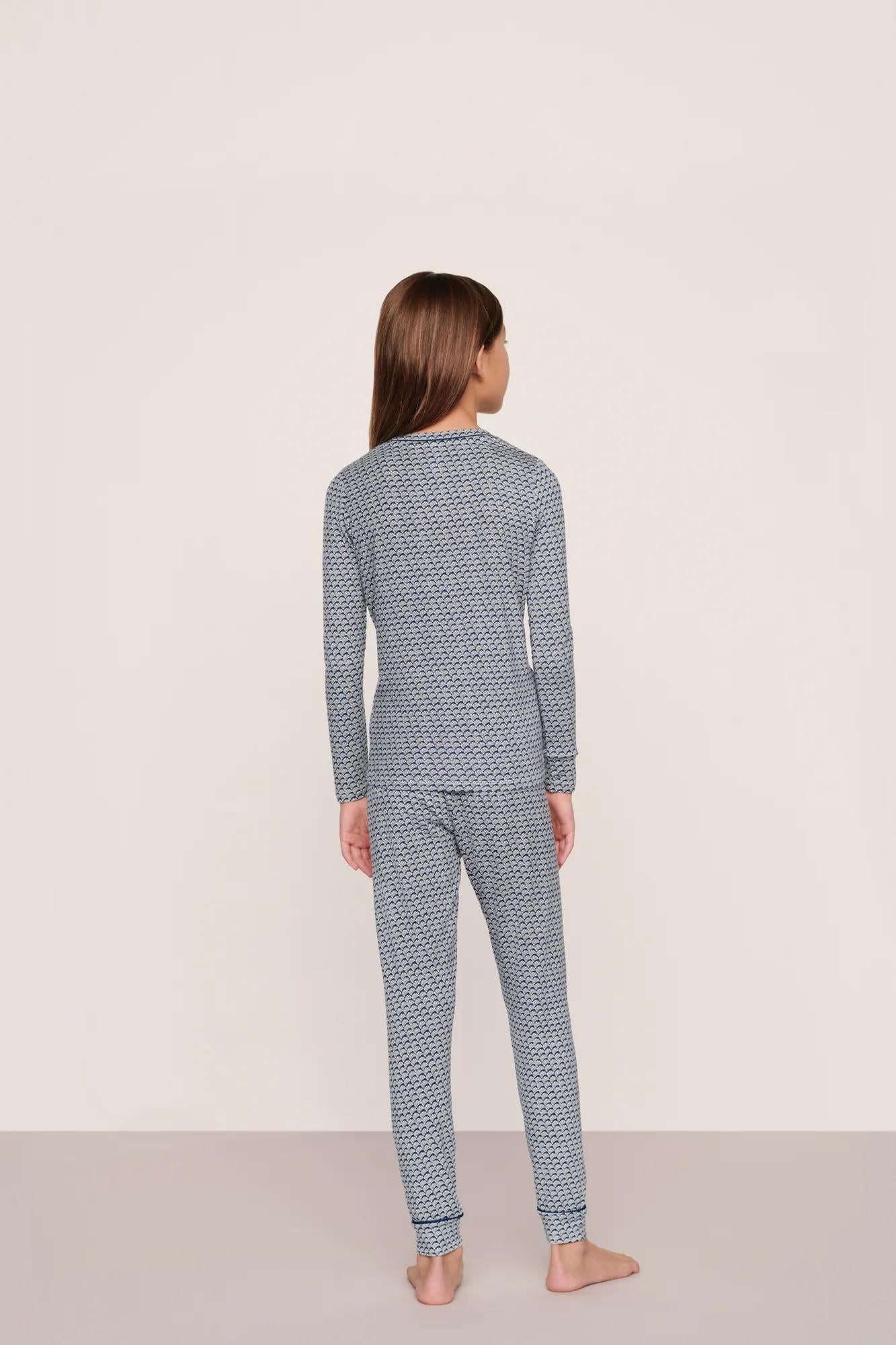 Model is wearing Kids Printed TENCEL™ Modal Unisex Long PJ Set  in Seashell Navy/Navy