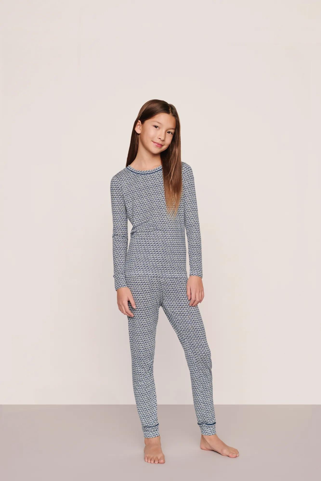 Model is wearing Kids Printed TENCEL™ Modal Unisex Long PJ Set  in Seashell Navy/Navy